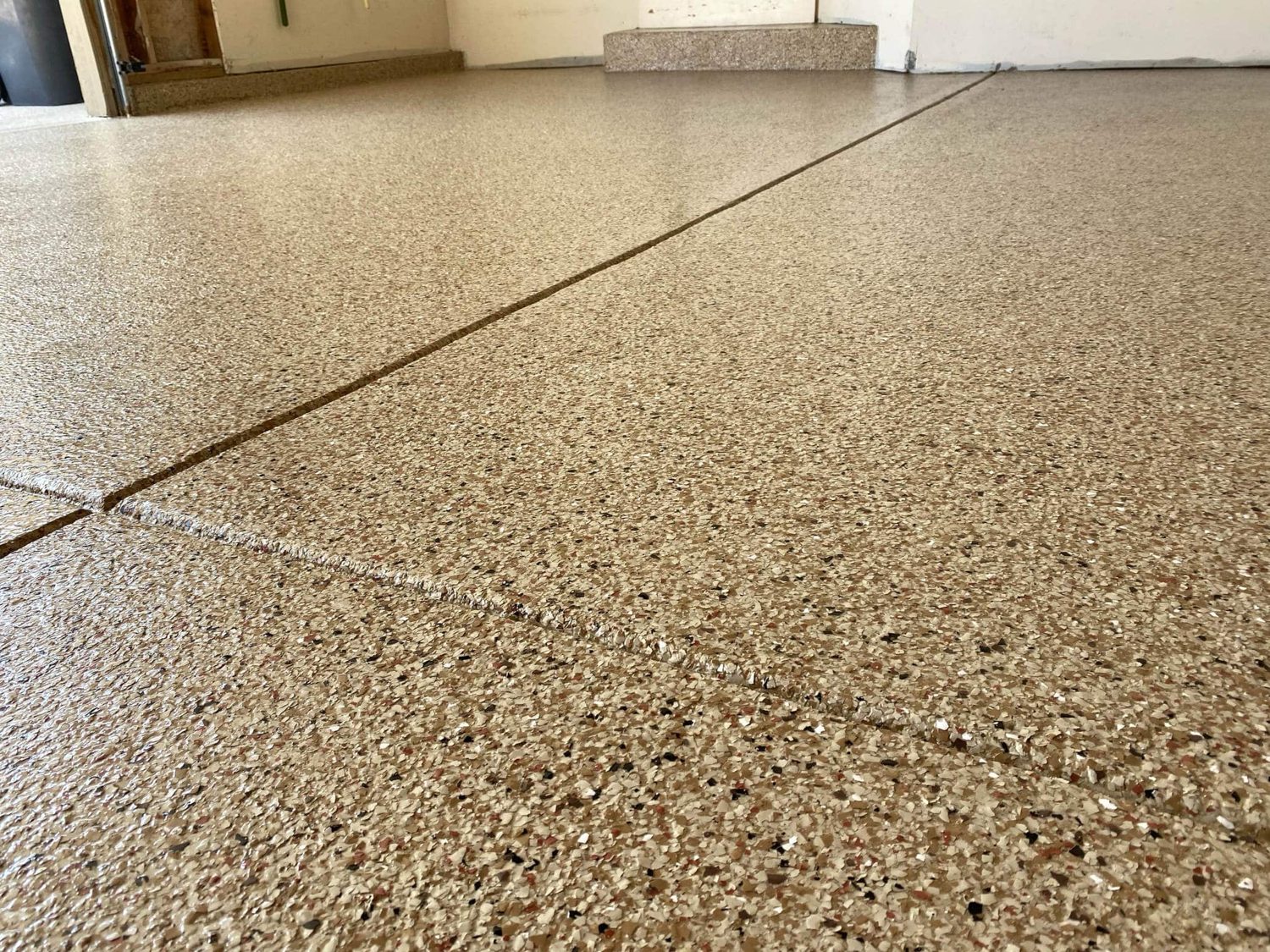 Polyurea vs. Epoxy: Why We Only Install Polyurea in Michigan Garages